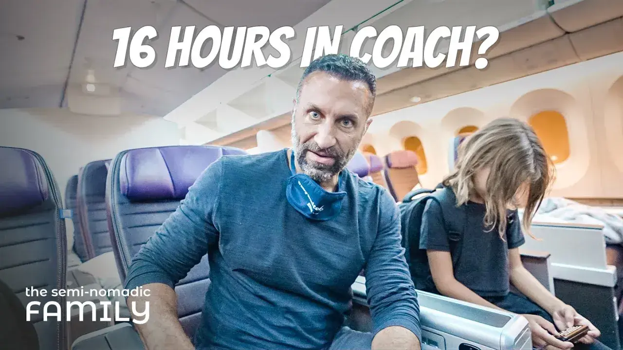 Phil Lockwood sitting in United Airlines' Premium Plus cabin