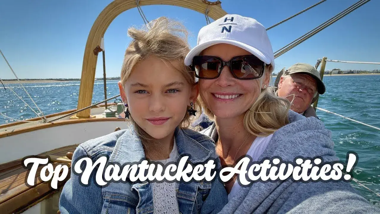 The Lockwood family sailing near a lighthouse on Nantucket