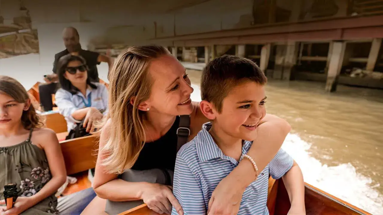 Erin and Colt Lockwood ride in a boat in Bangkok's floating market
